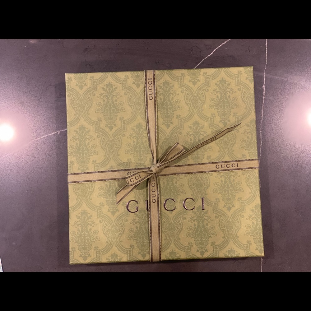 Gucci box with ribbon and tissue inside